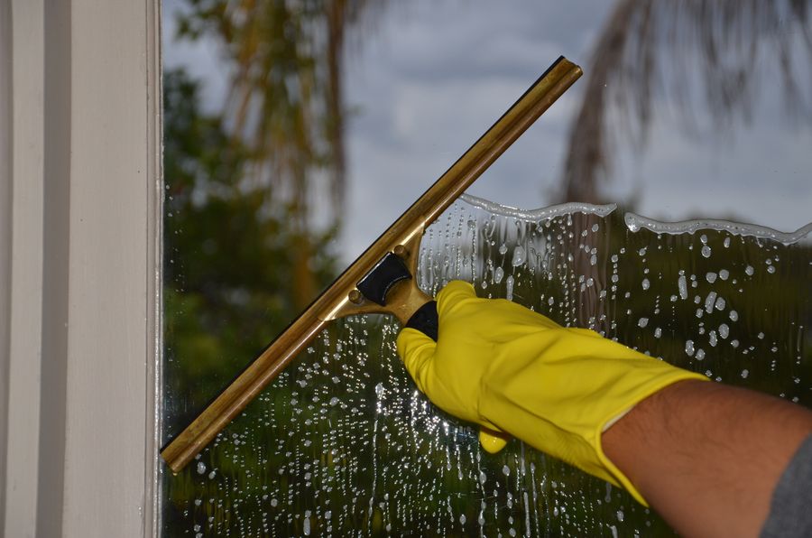 Cleaning a window with a squeegee